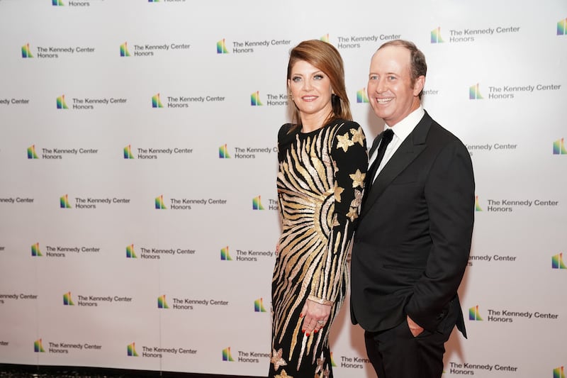 CBS anchor Norah O'Donnell and husband Geoff Tracy pose on the red carpet at the reception for Kennedy Center honorees ahead of the official gala at the State Department in Washington, D.C., U.S., December 3, 2022. REUTERS/Sarah Silbiger