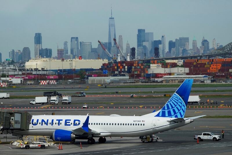 A plane docks on the tarmac after an air traffic control outage at Newark Liberty International Airport