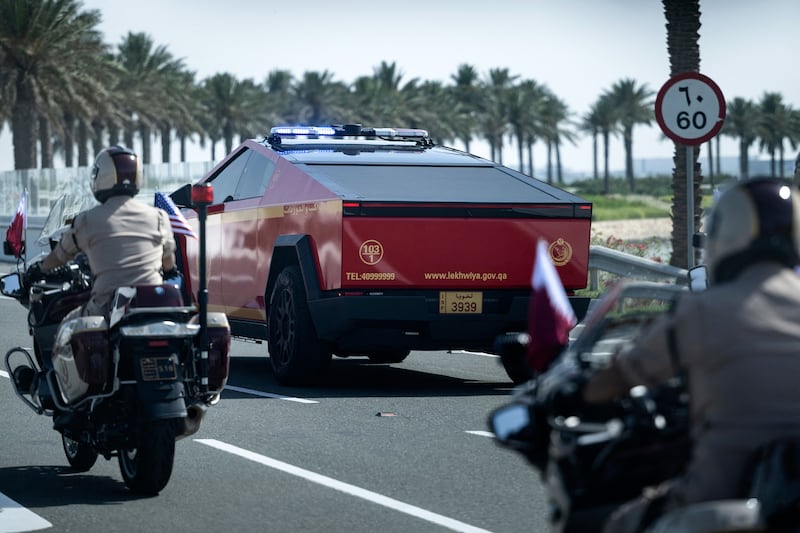 A Qatari police Tesla Cyber Truck escorts the motorcade of President Donald Trump from Hamad International Airport toward the Royal Palace in Doha on May 14, 2025.