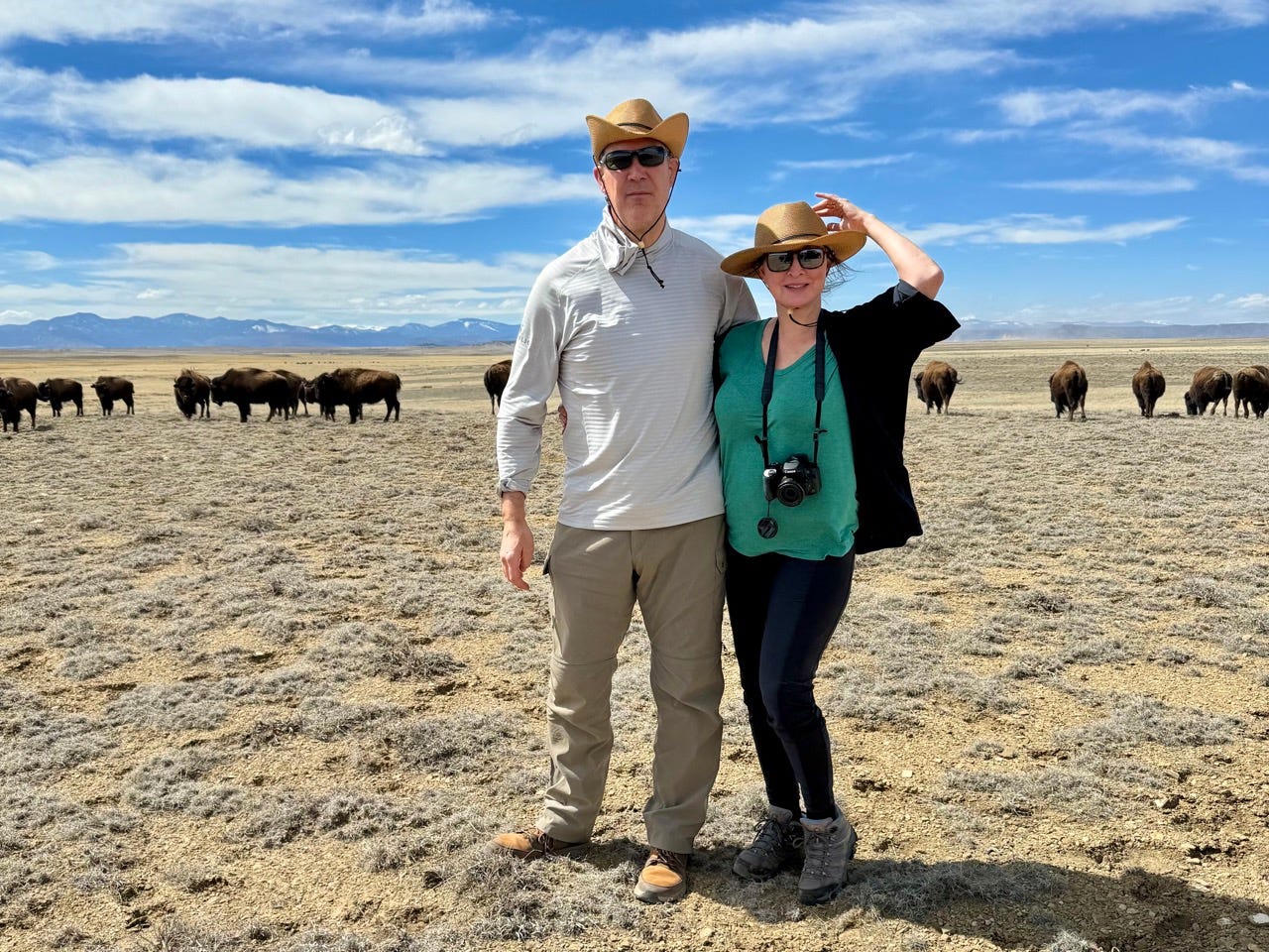 Author and her partner near bison