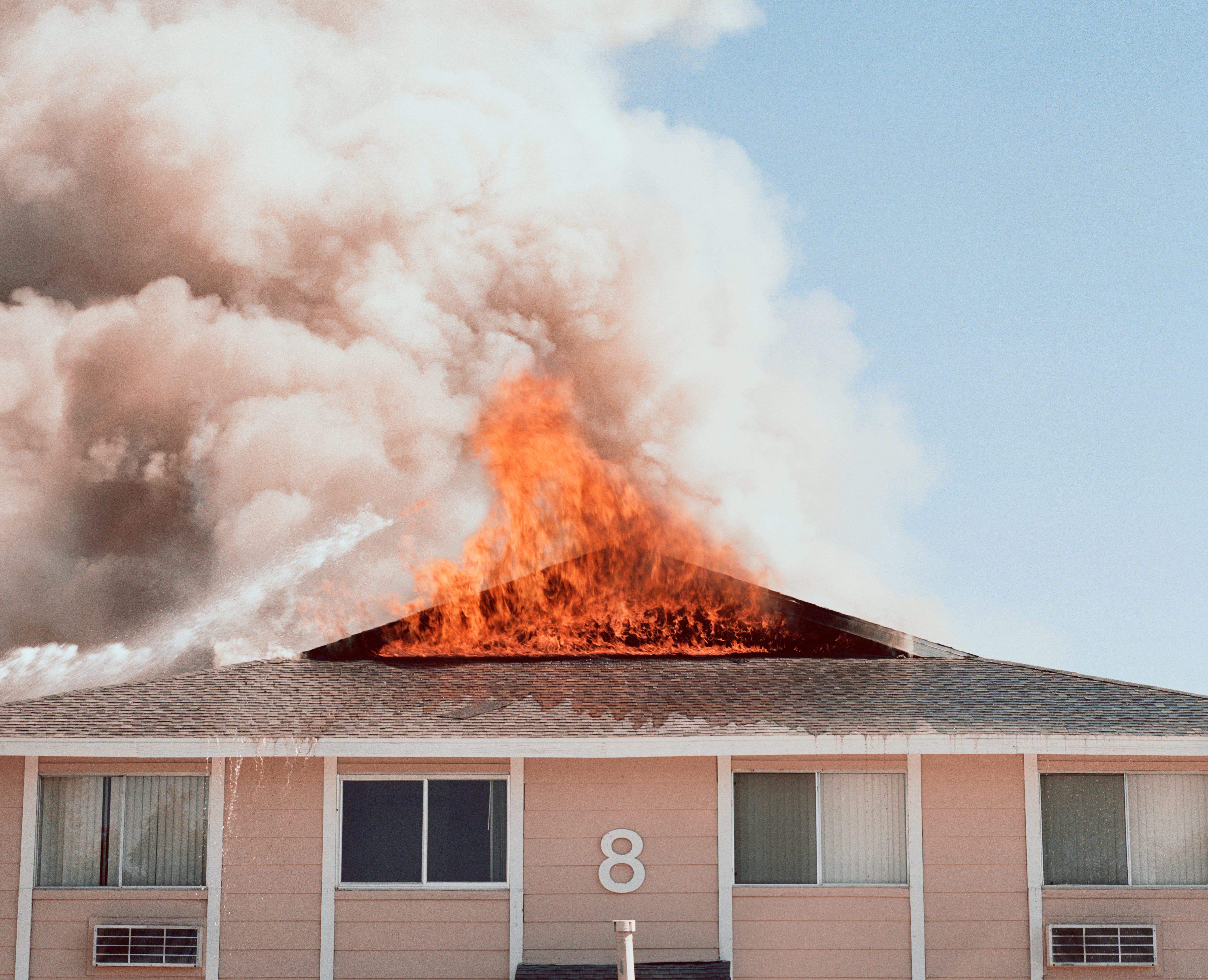 A house burns on fire.