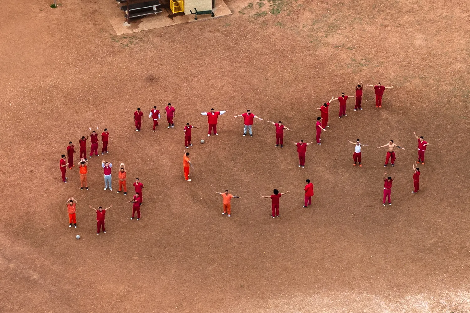 A drone view of detainees forming the letters “SOS” with their bodies in the courtyard at the Bluebonnet Detention Facility, where Venezuelans at the center of a U.S. Supreme Court ruling are held, in Anson, Texas, on April 28. (Paul Ratje/Reuters)