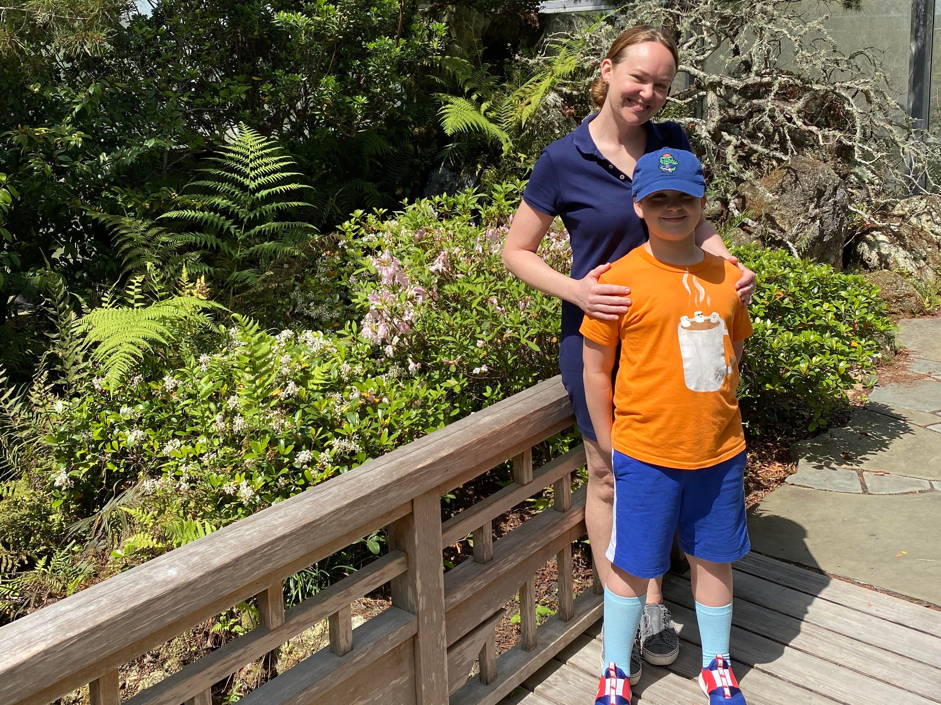 Mom and son posing for photo