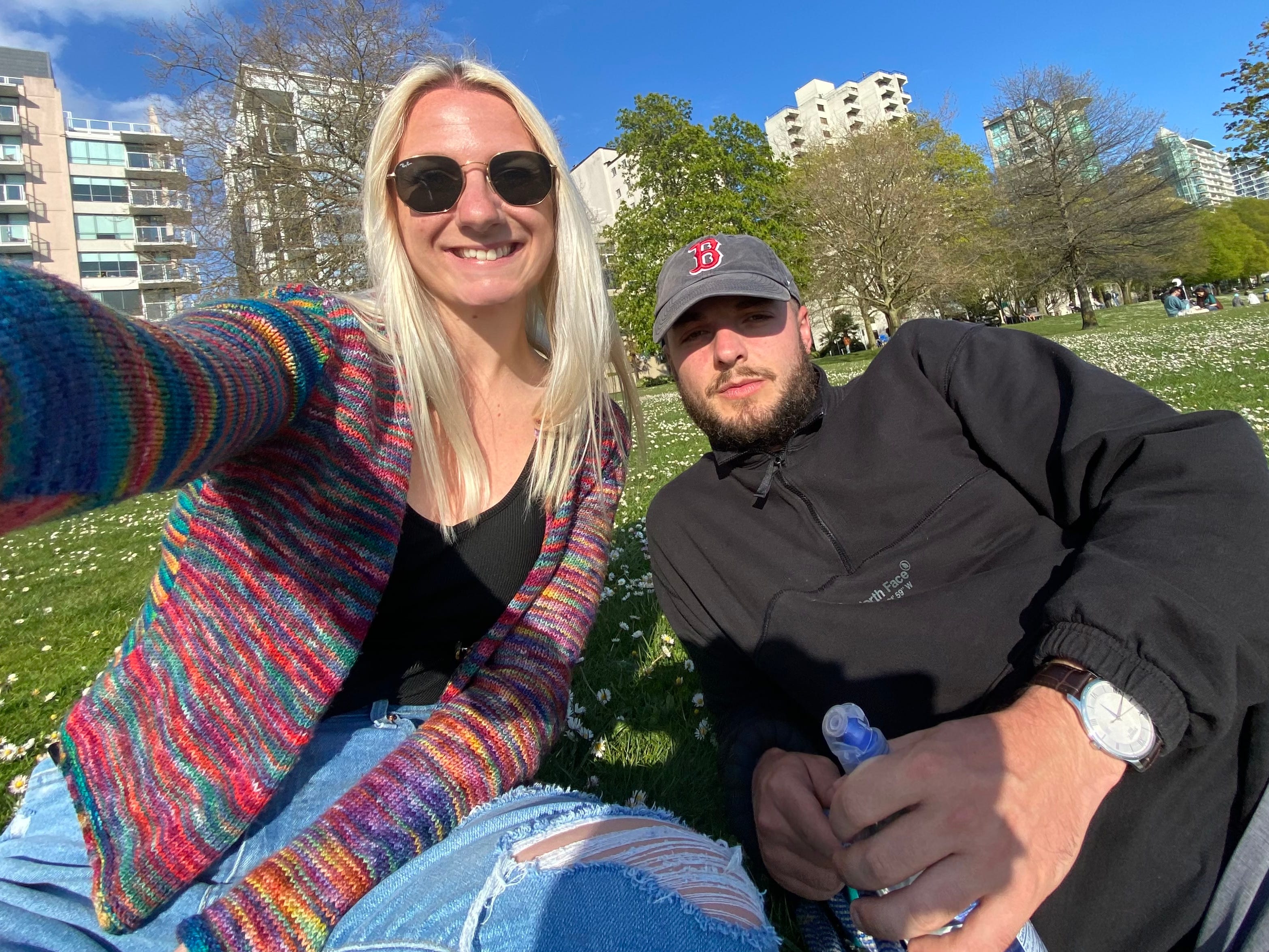 The author and her boyfriend in a park on a sunny day.