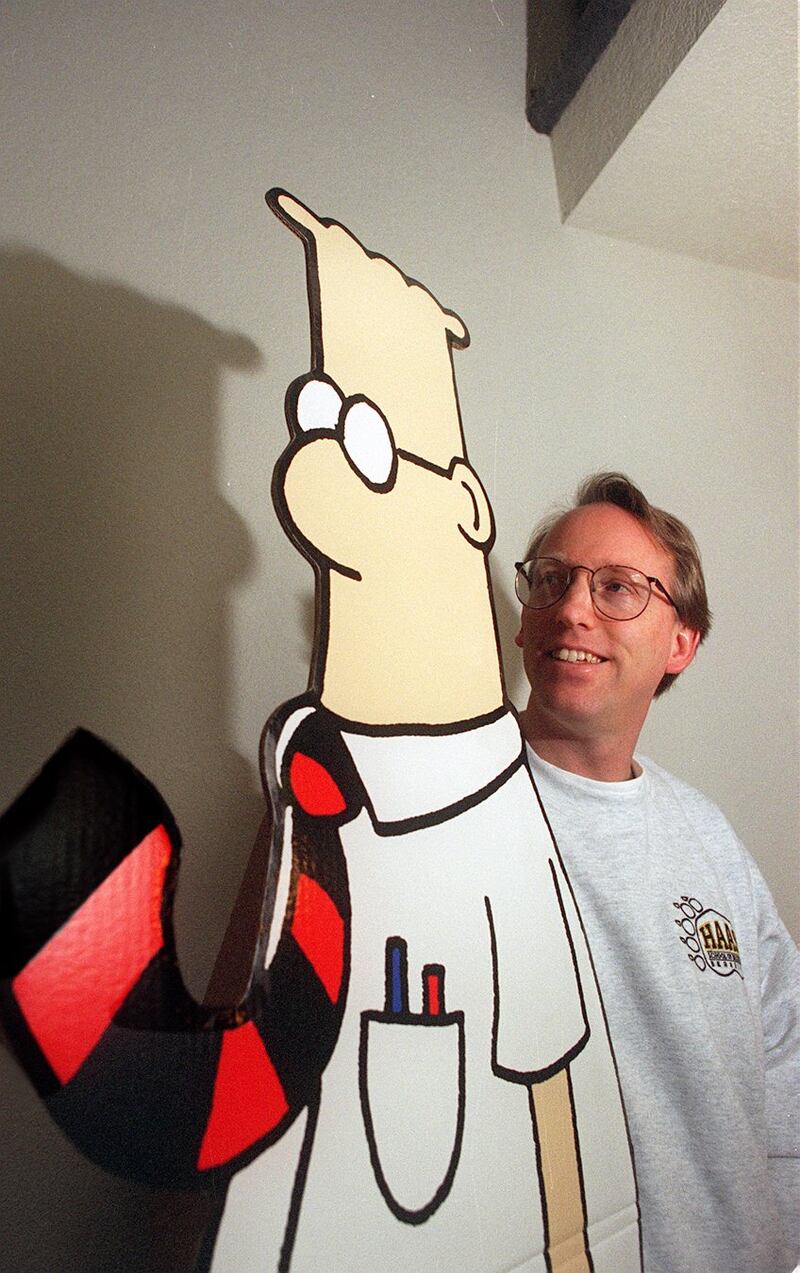 Scott Adams with a cutout of his "Dilbert" character.
