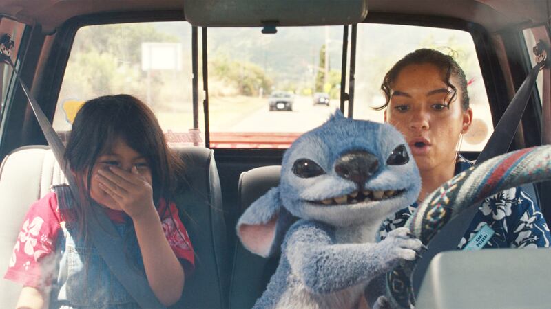 Maia Kealoha, Stitch, and Sydney Agudong in Disney’s live-action Lilo & Stitch.
