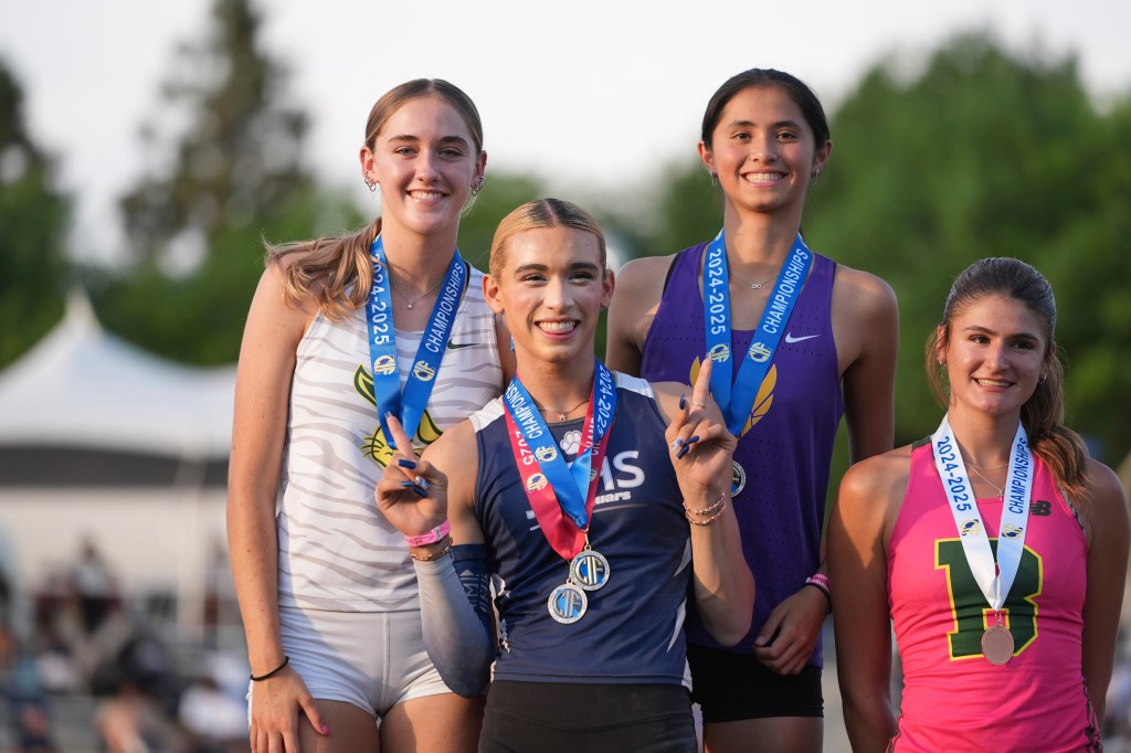 AB Hernandez poses with the runner-ups of the high jump event.