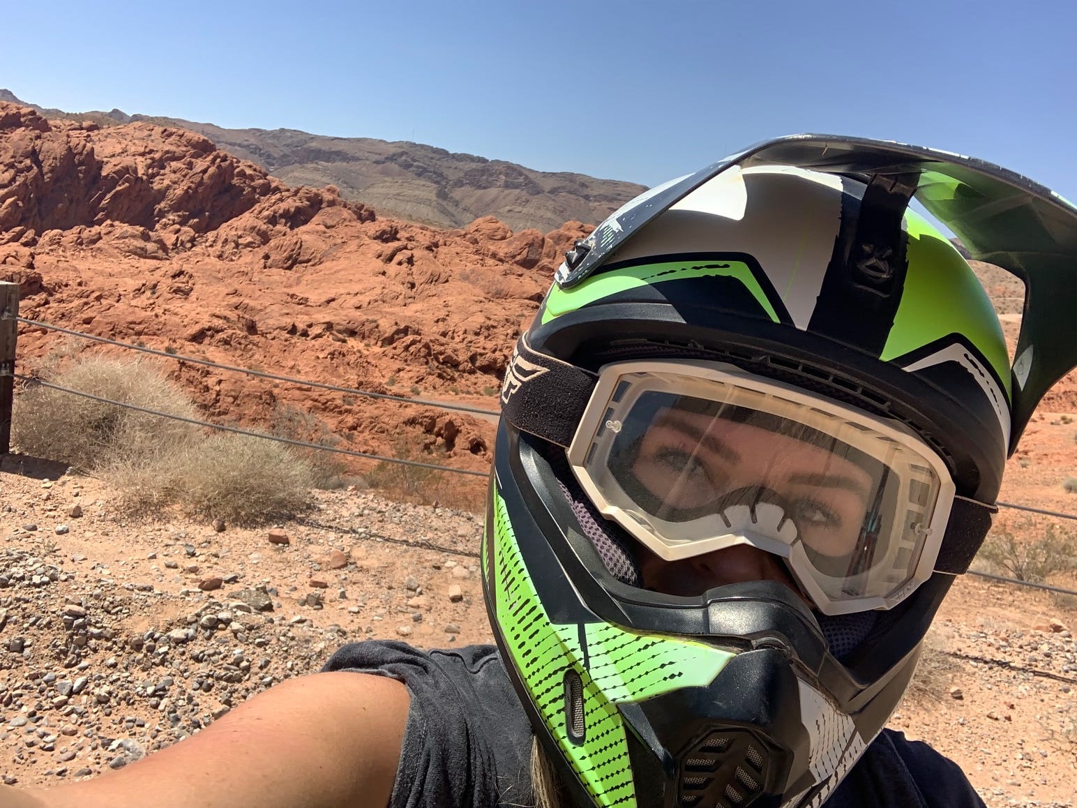 Author Hayley Hutson wearing helmet in desert selfie