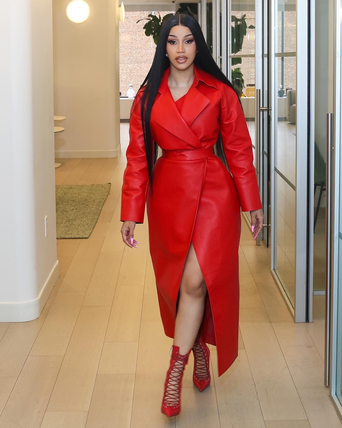 Card B in a red outfit 