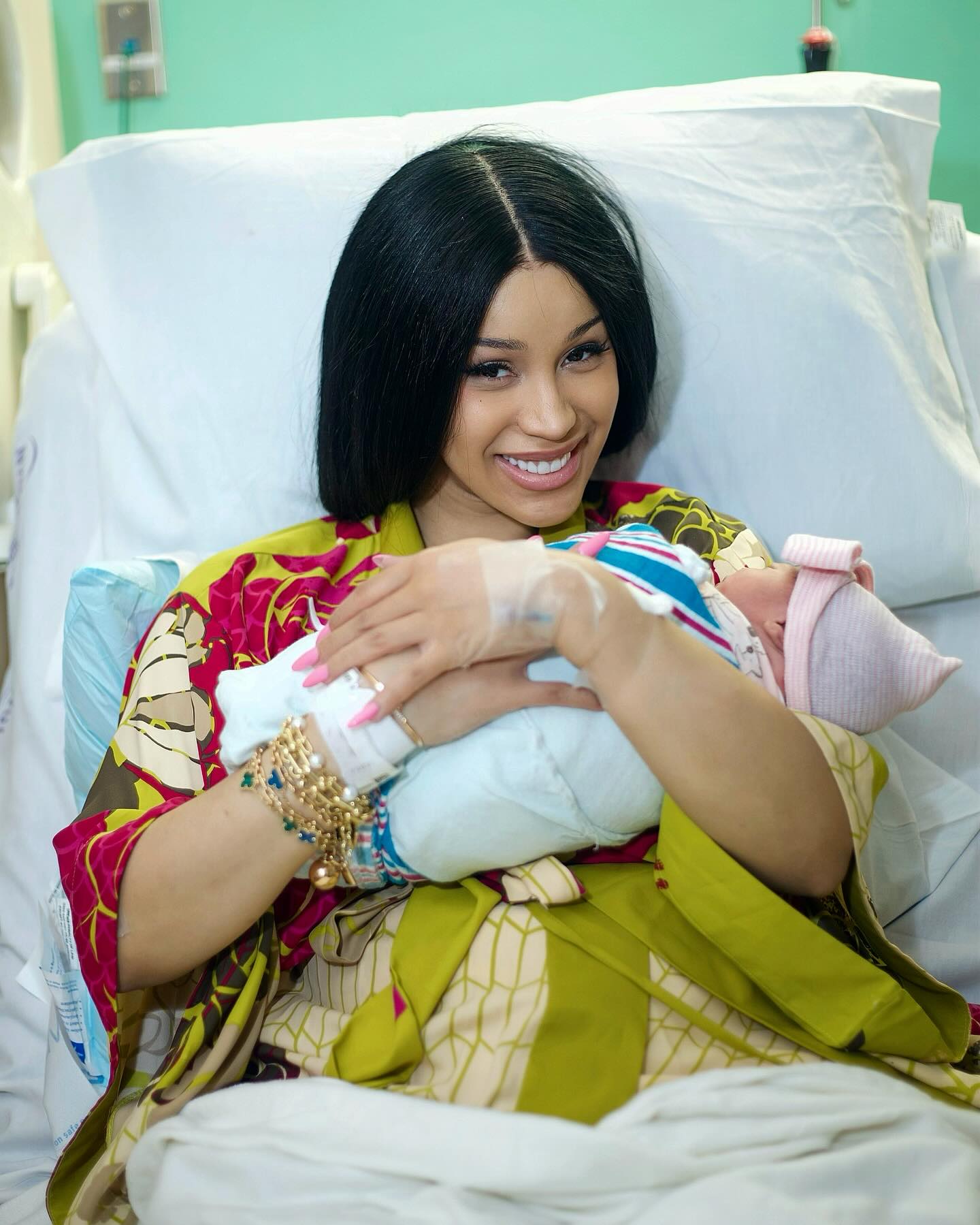 Cardi B holding baby Blossom