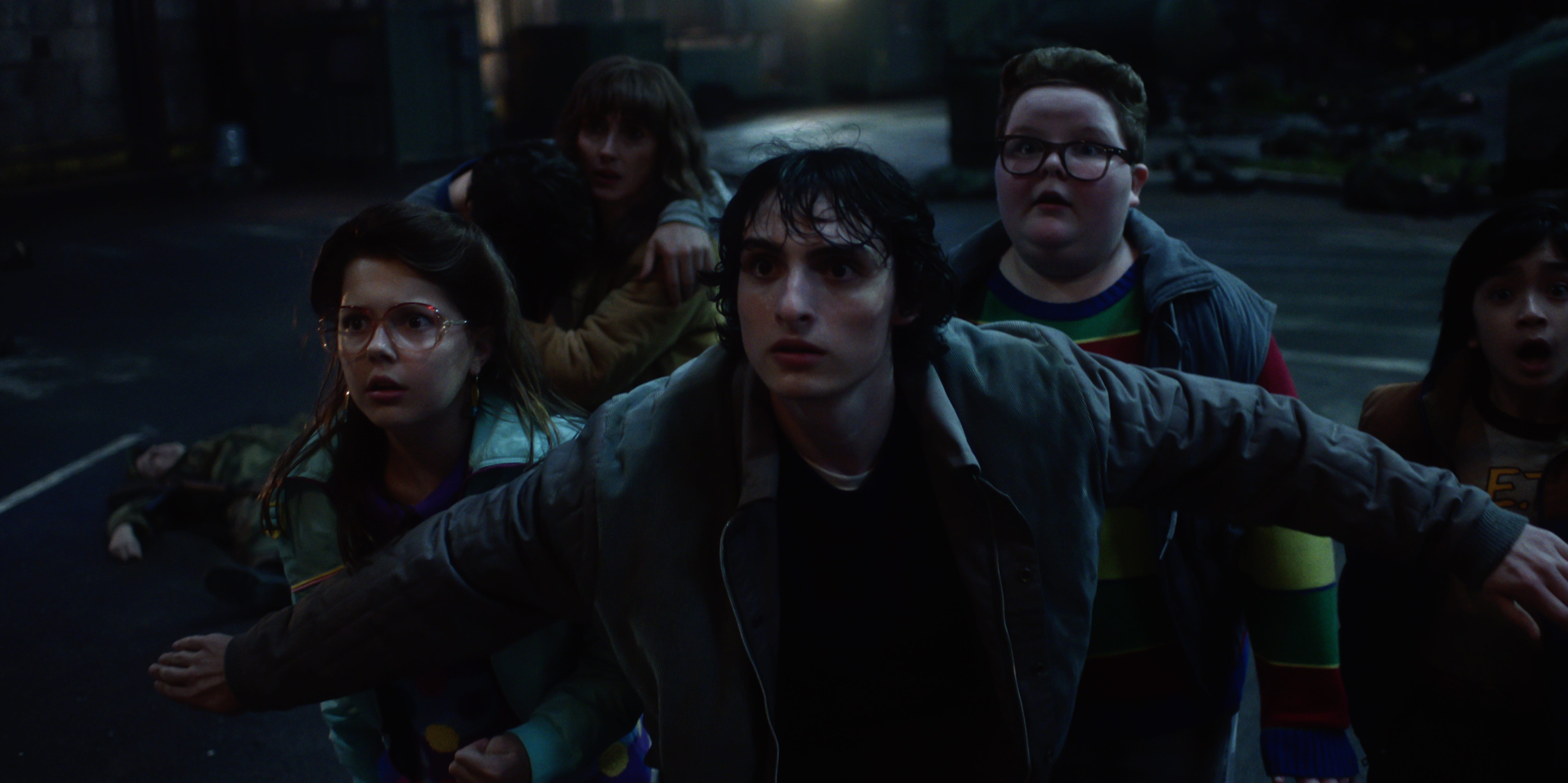 Winona Ryder as Joyce Byers, Finn Wolfhard as Mike Wheeler, and Jake Connelly as Derek in season five of "Stranger Things."