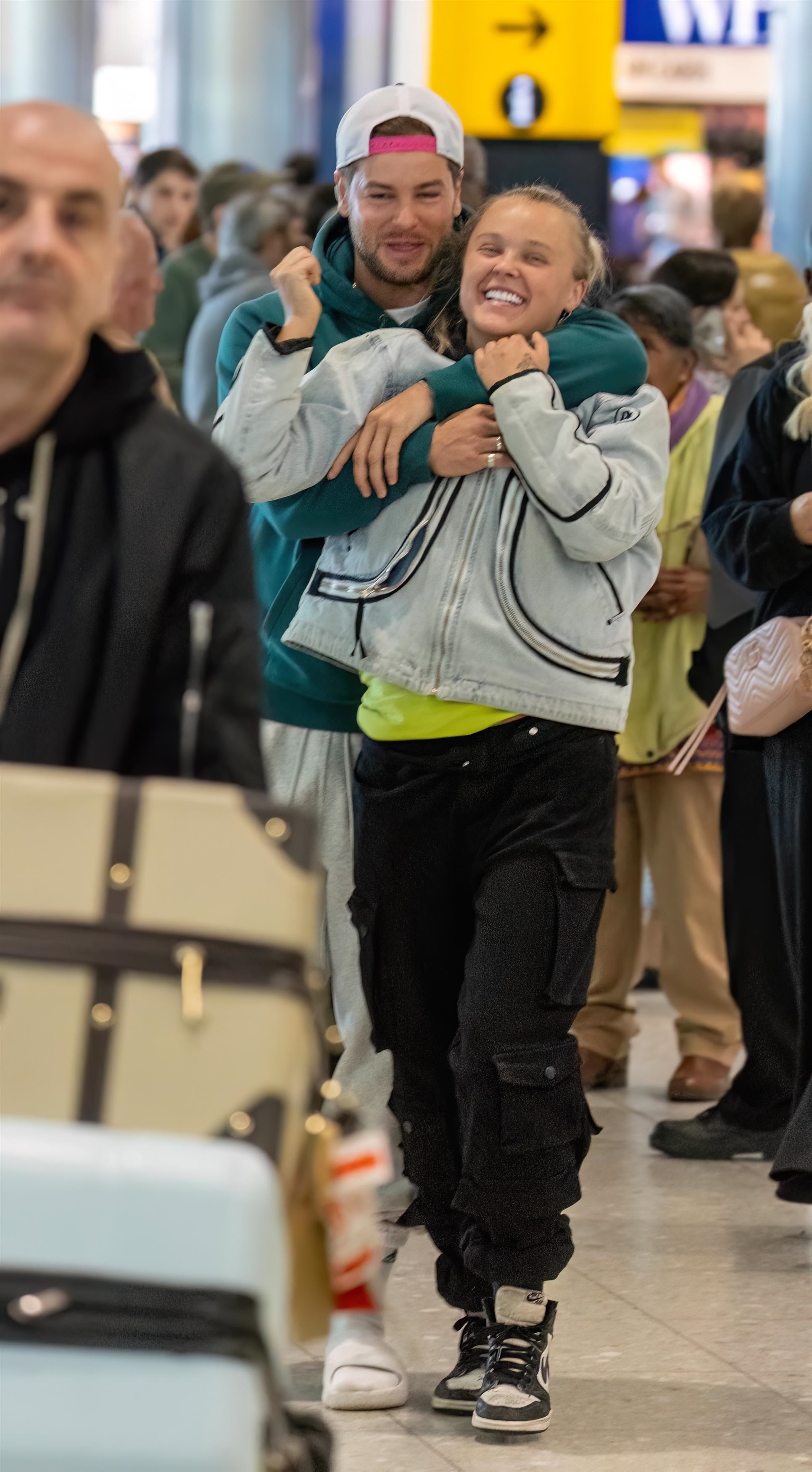 JoJo Siwa and Chris Hughes in the London airport
