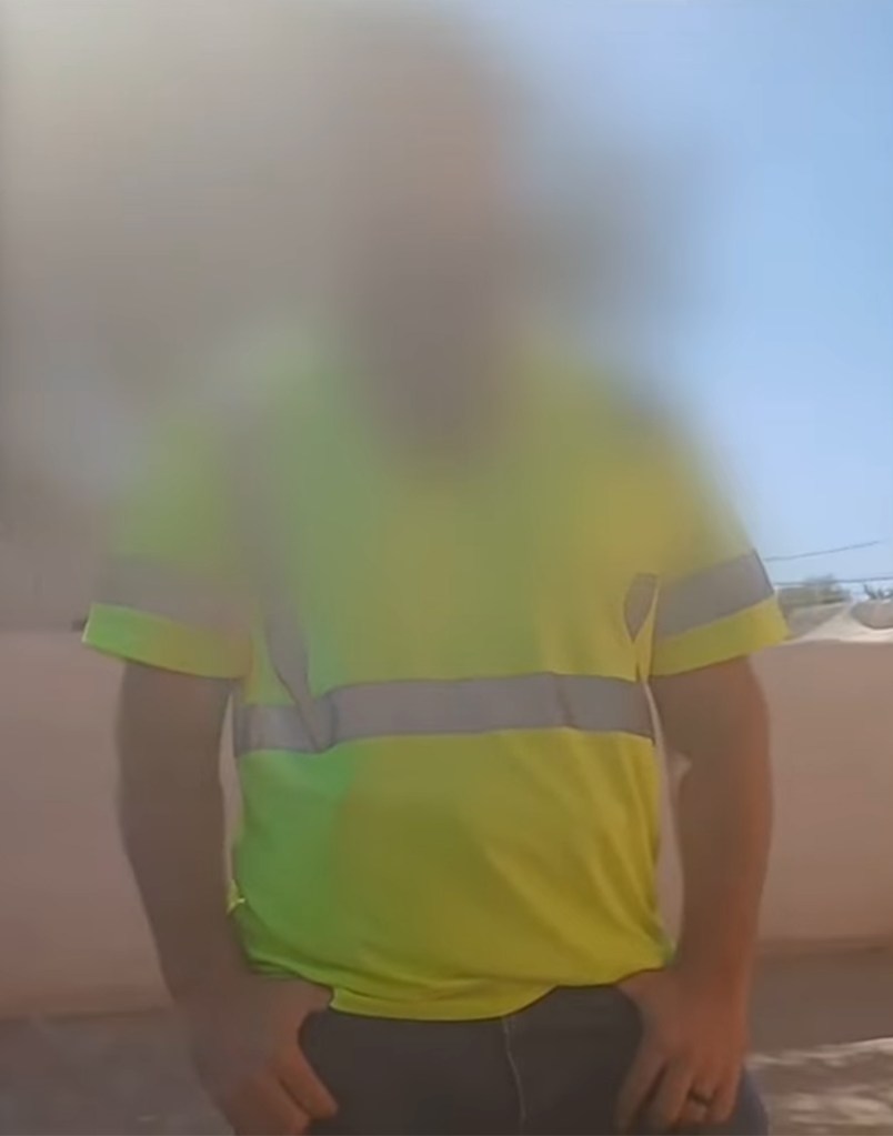 One of the men wore a reflective shirt to look like a city worker, video shows
