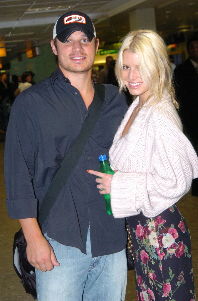 Jessica Simpson and husband Nick Lachey arriving at London's Heathrow airport in 2005.