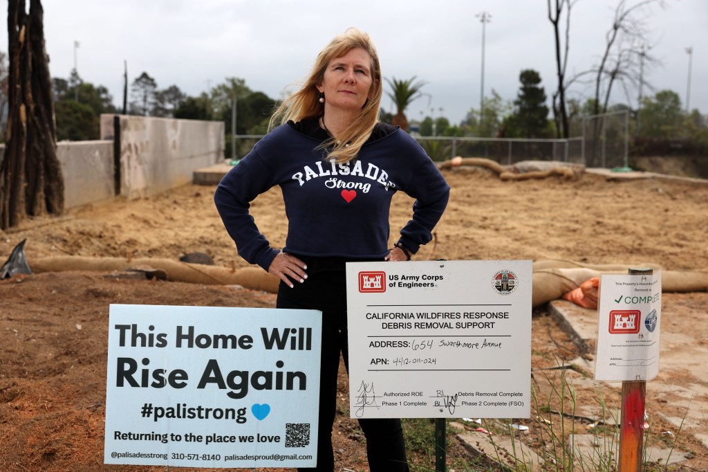 Homeowner Sara Trepanier stands in front of her recently-cleared lot. She said it could take a year to finish her new home.