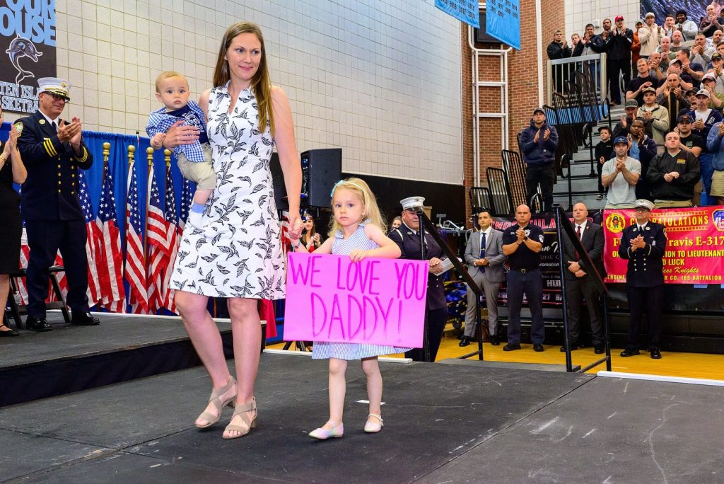 Dziemian's wife Jackee and their two children accepted the promotion on his behalf at a ceremony on Staten Island.