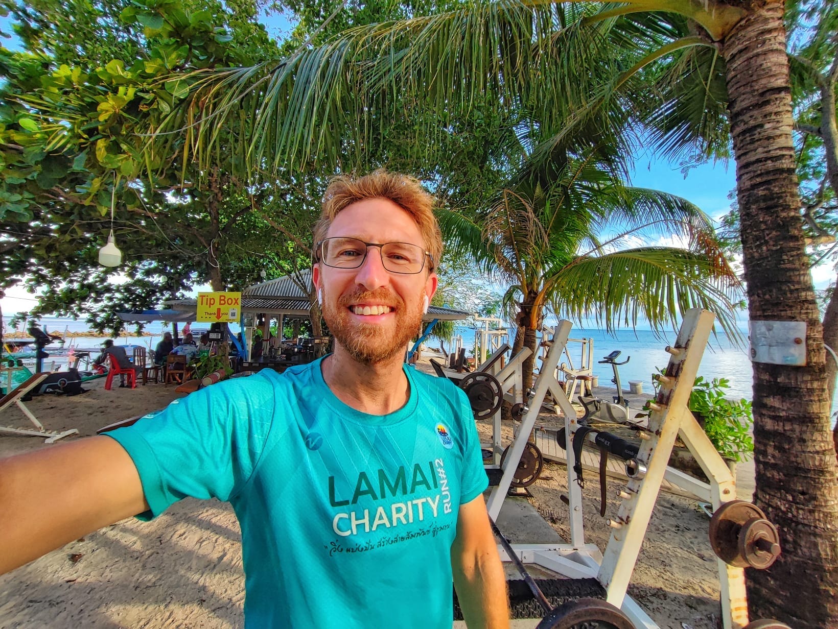 A man taking a selfie at an outdoor gym in Koh Samui, Thailand.