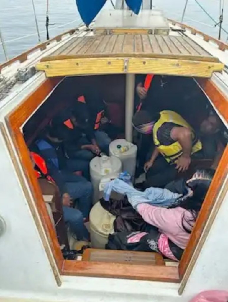 Migrants cram into sailboat.