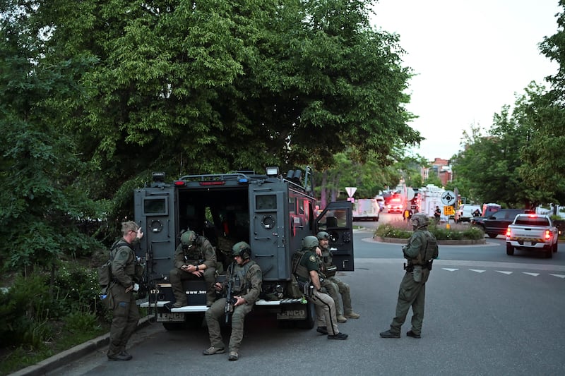 Policemen gather near the scene of an attack that injured multiple people, in Boulder, Colorado.