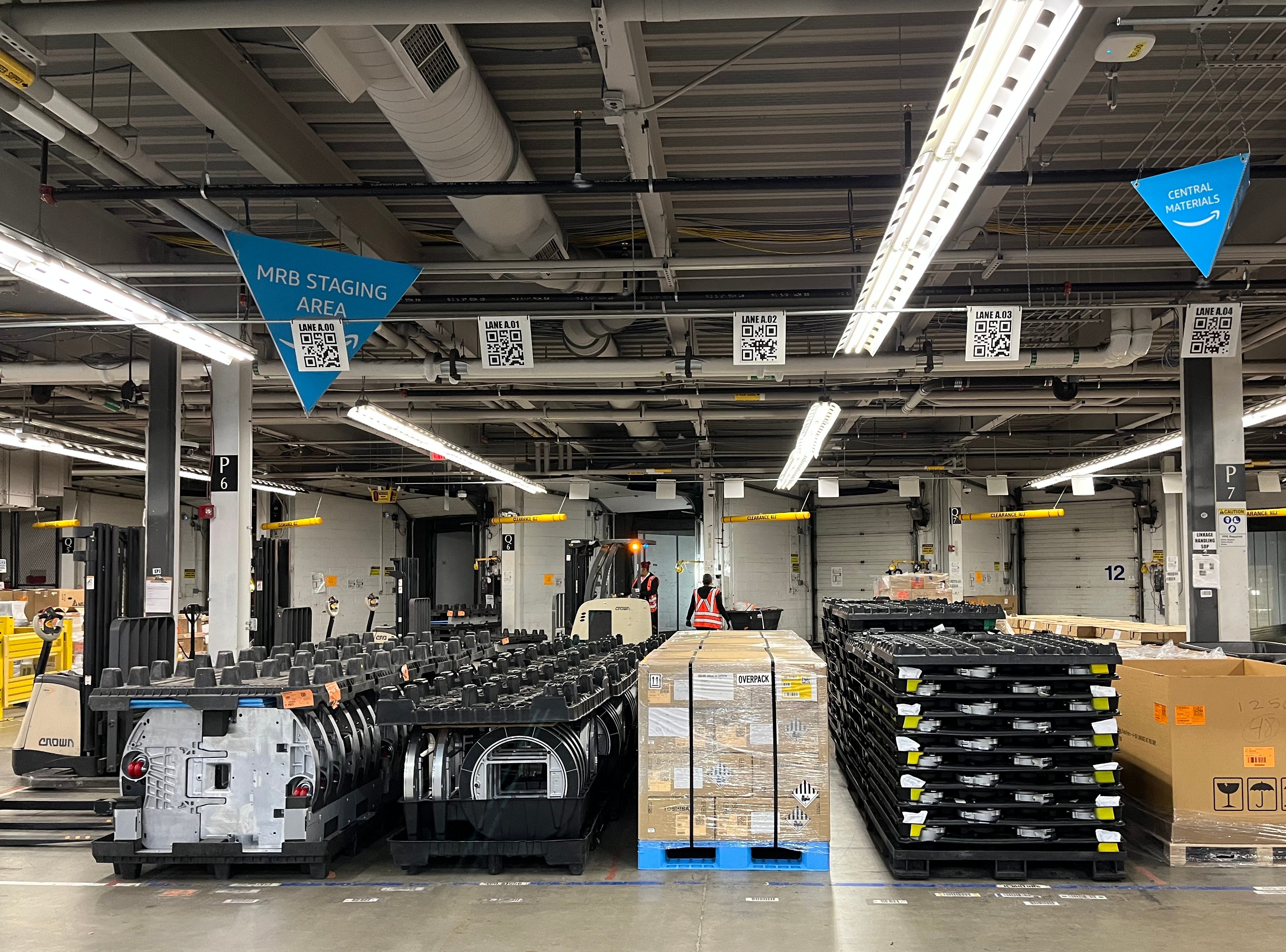 Robotic parts are being unloaded in Amazon's North Reading facility