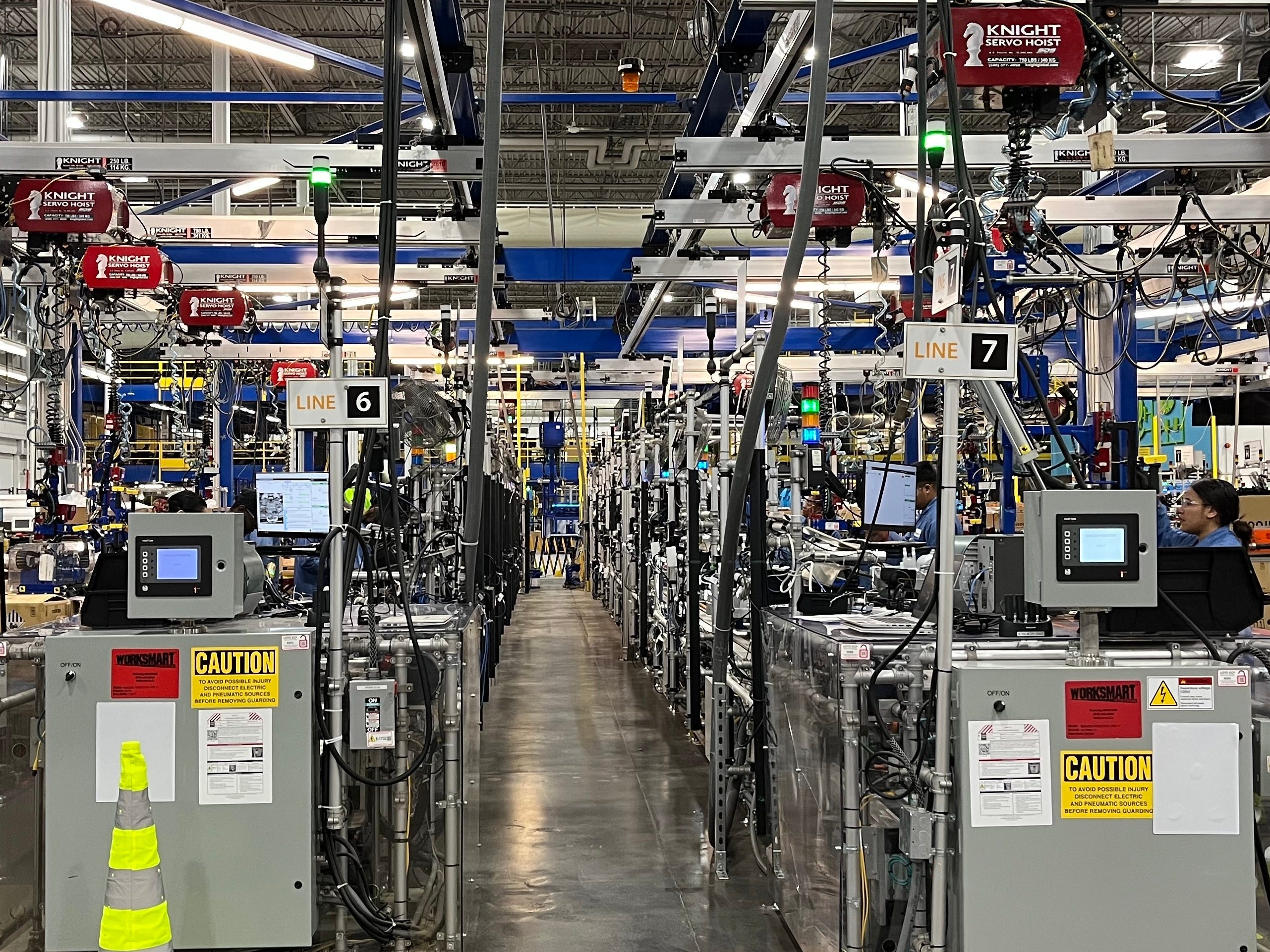Photo shows assembly line inside Amazon Robotics facility in North Reading, Massachusetts