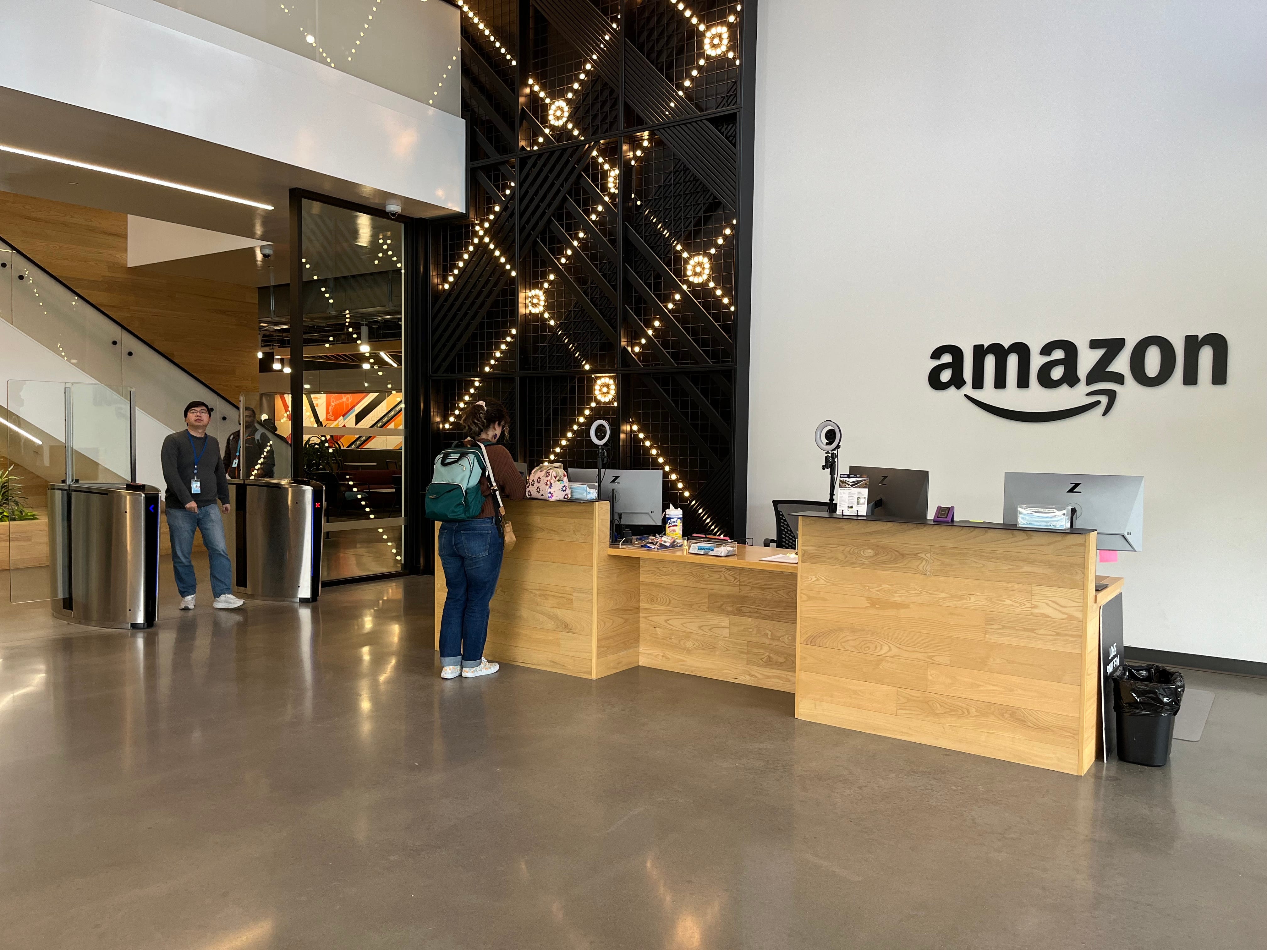 Lobby has Amazon logo and light design by turnstiles