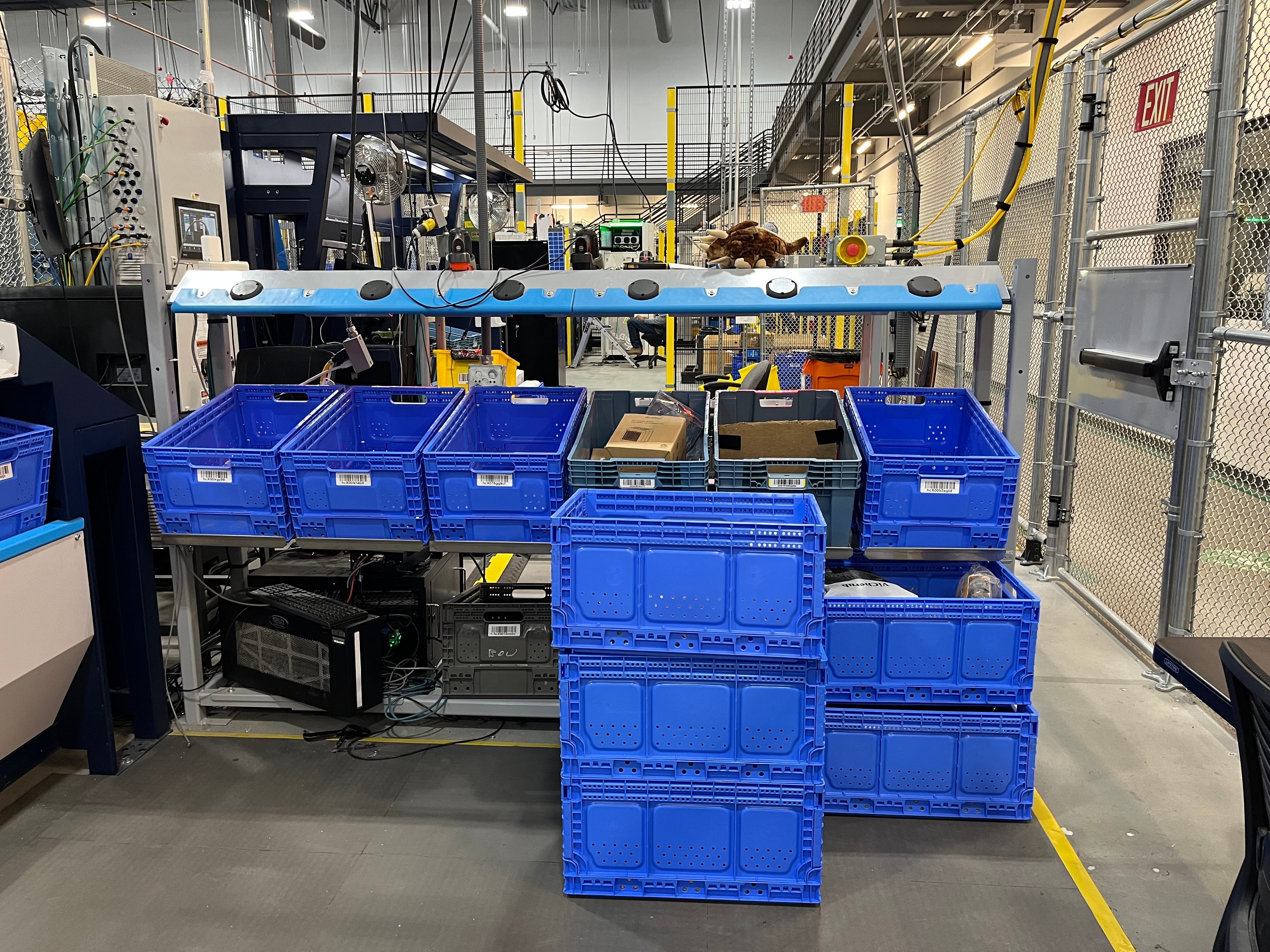 Sequoia robotic storage system has blue totes lined up