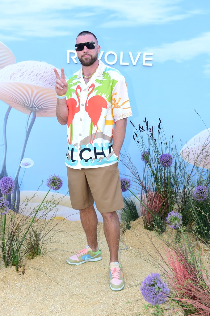Travis Kelce wearing a flamingo shirt at the Revolve festival during Coachella 2023