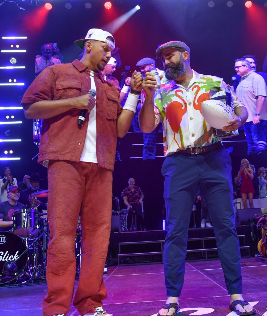 Patrick Mahomes and Jason Kelce on stage during a charity event in Kansas City 