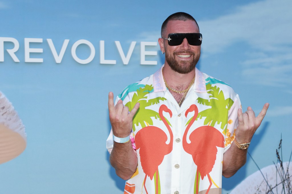 Travis Kelce wearing a flamingo shirt at the Revolve festival during Coachella 2023
