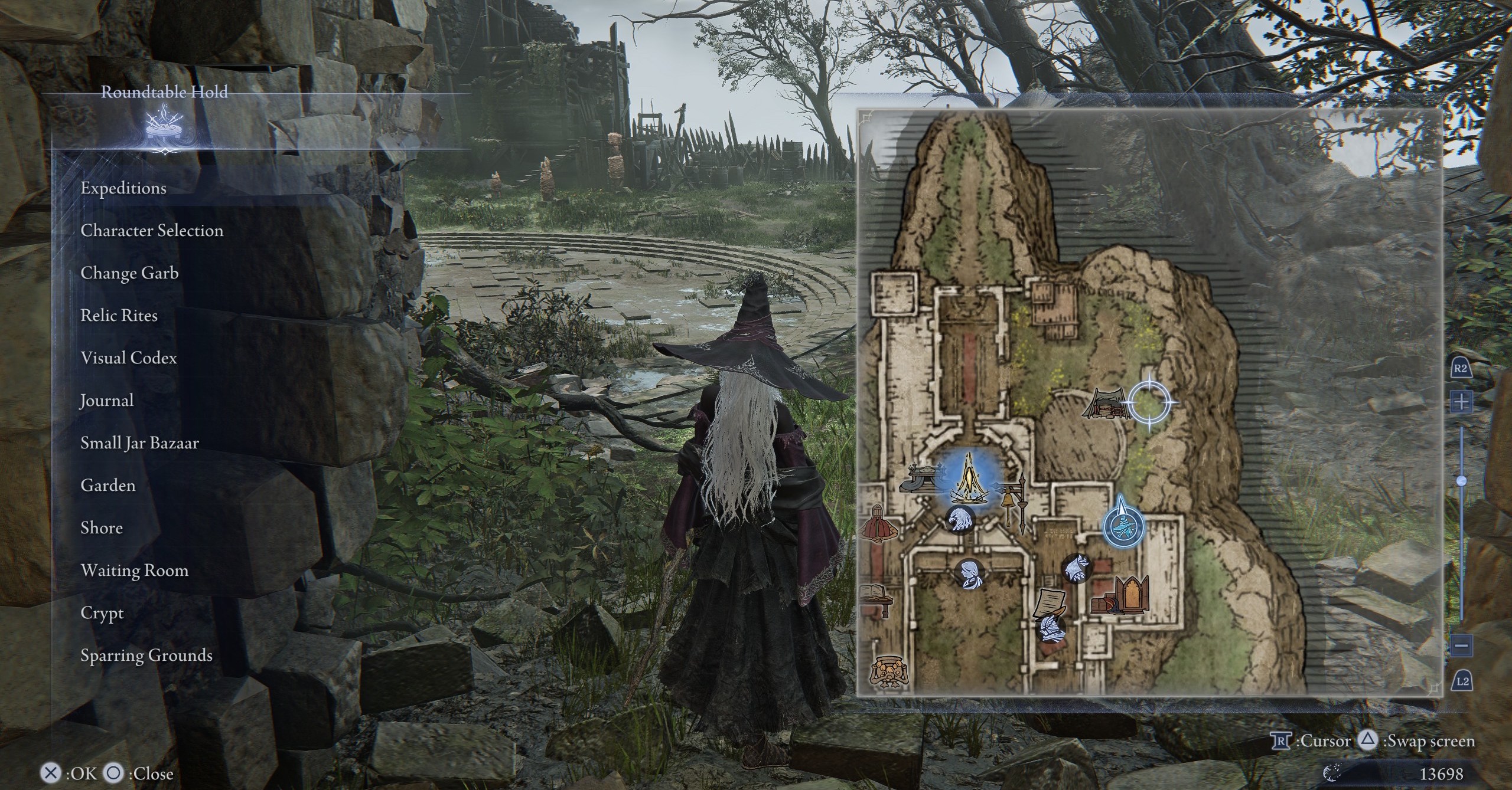 The Recluse in Elden Ring Nightreign, standing in the Rountable Hold’s training grounds where the lurking presence is