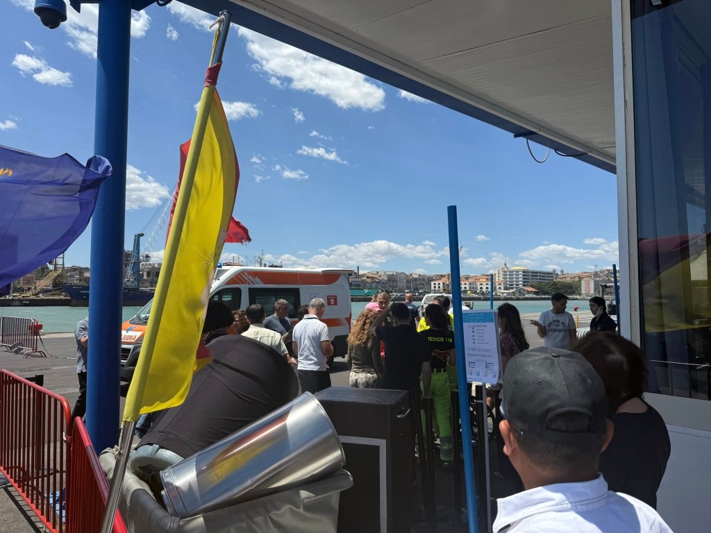 Passengers waiting to board a ferry.