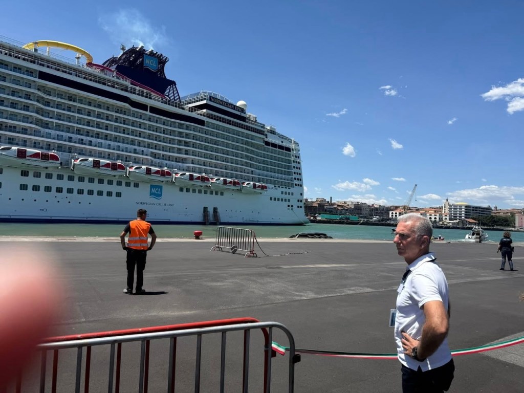 Norwegian Epic cruise ship docked at a port.