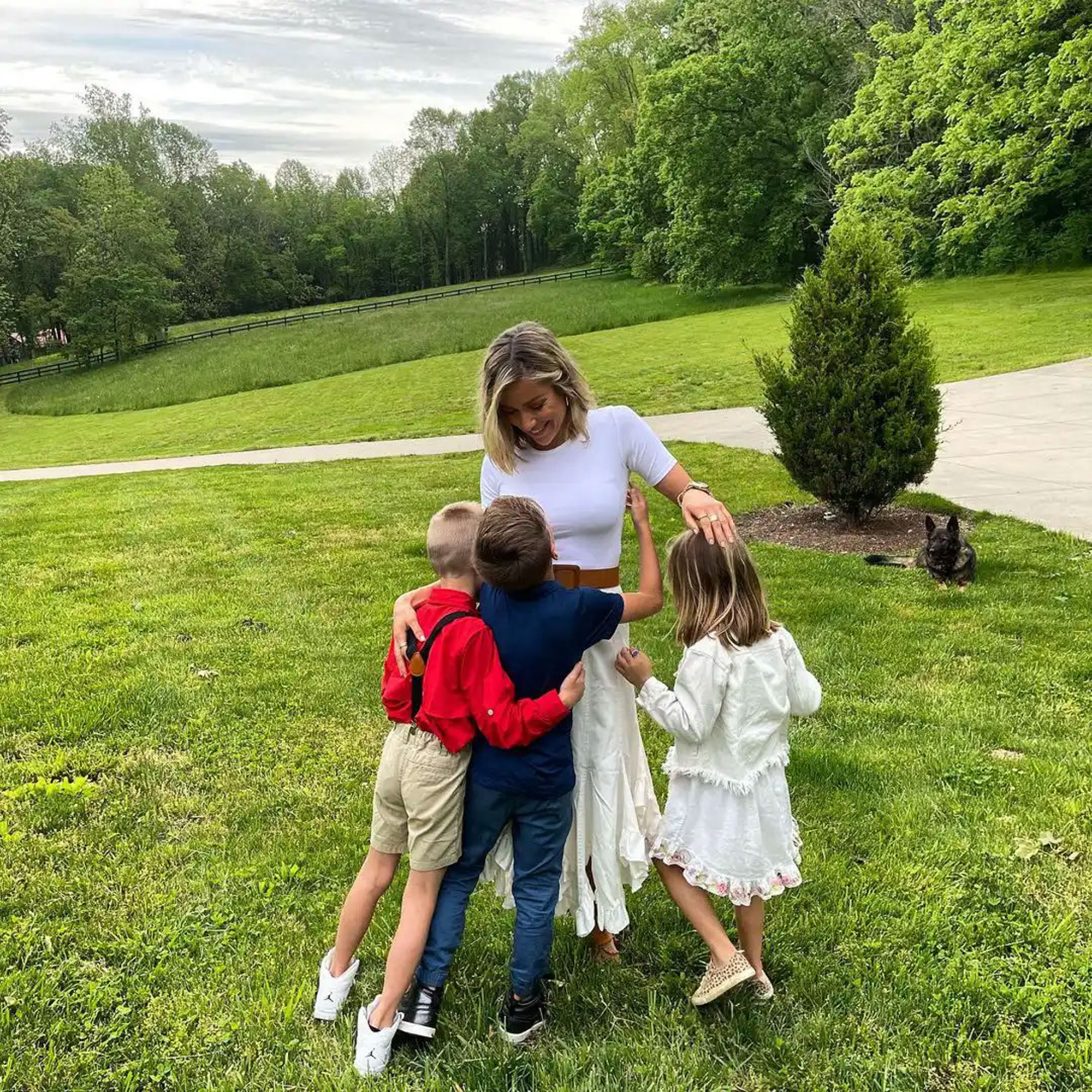 Kristin Cavallari and her three children hug outdoors. 