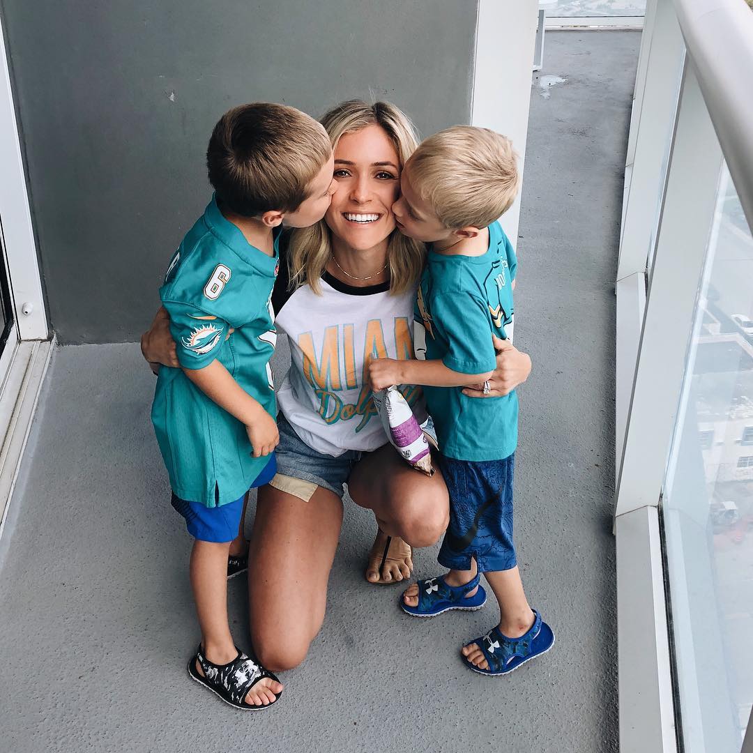 Kristin Cavallari gets a cheek kiss from two little boys. 