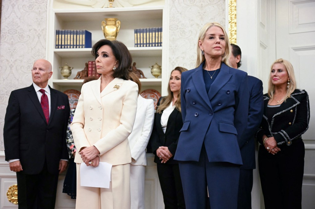 Interim Attorney for the District of Columbia, Jeanine Pirro (L) and US Attorney General Pam Bondi (R) look on as US President Donald Trump speaks during a swearing in ceremony, in the Oval Office of the White House in Washington, DC, on May 28, 2025. 