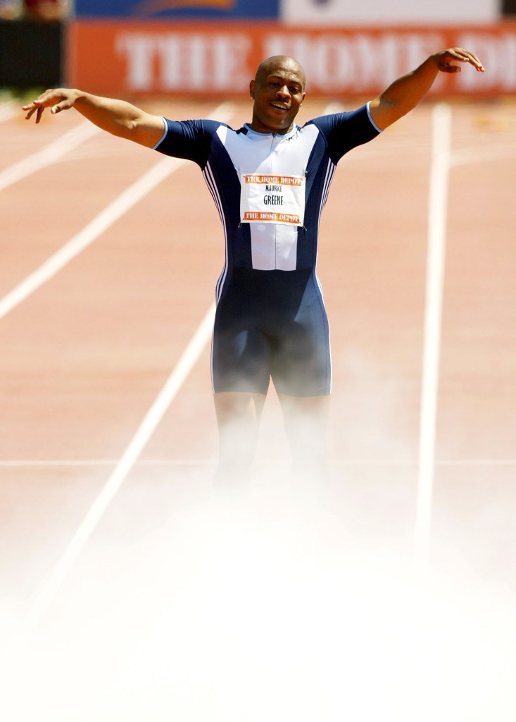Maurice Greene celebrates as teammates spray his feet with a fire extinguisher after winning the Men's 100 meter with a time of 9.86 during the Home Depot Invitational, the first invitational stop on USA Track & Field?s 2004 Outdoor Golden Spike Tour on May 22, 2004 at the Home Depot Center in Carson, California.