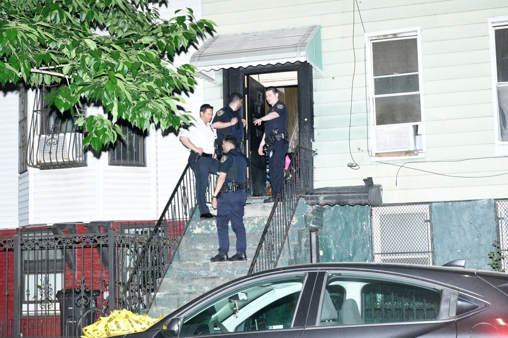 Police officers investigating a crime scene in Brooklyn, NY.