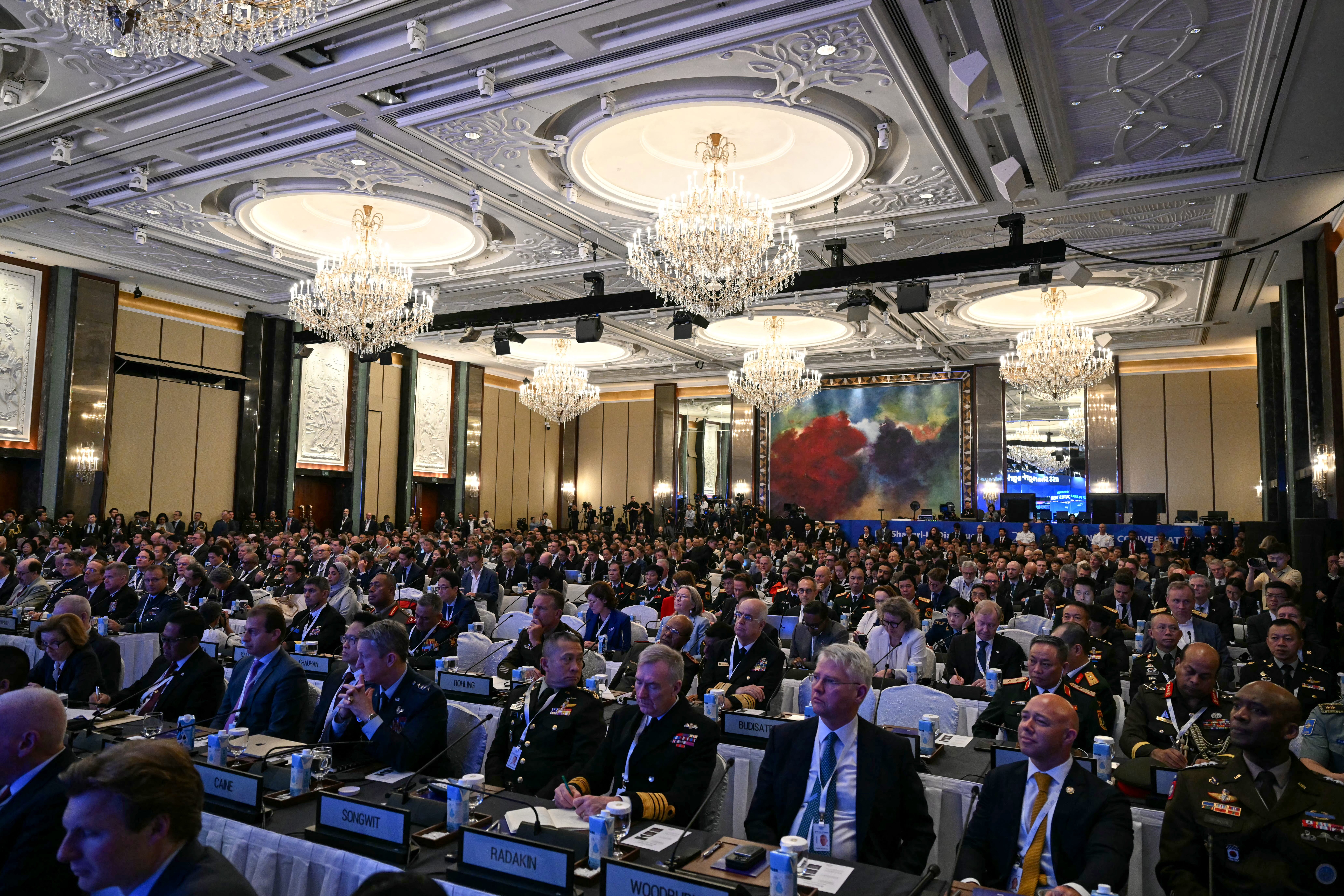 Delegates sit in the Island ballroom of the Shangri-La Hotel.