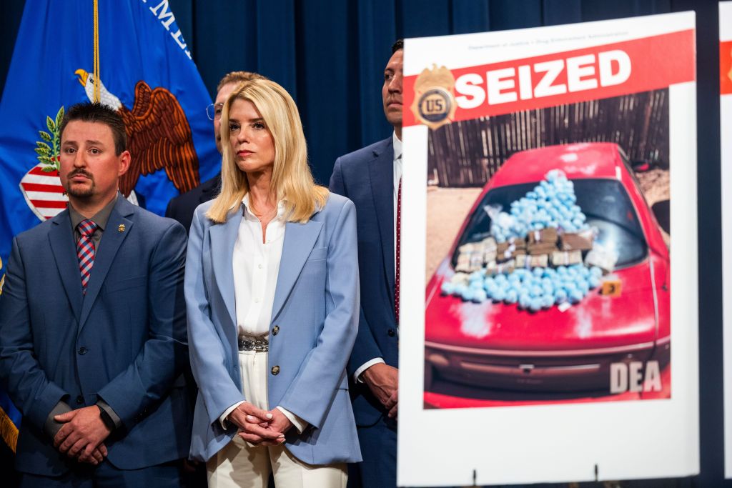 Attorney General Pamela Bondi and DEA officials announce a drug bust at a press conference.