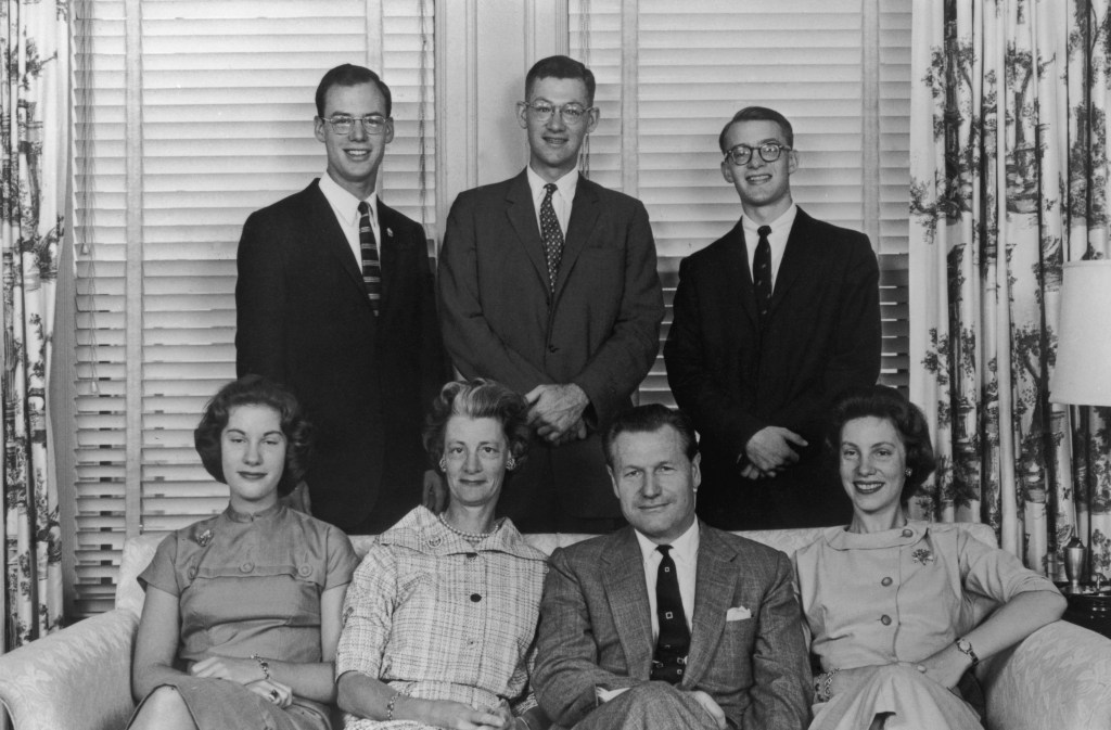 Black and white photo of Nelson Rockefeller with his family.