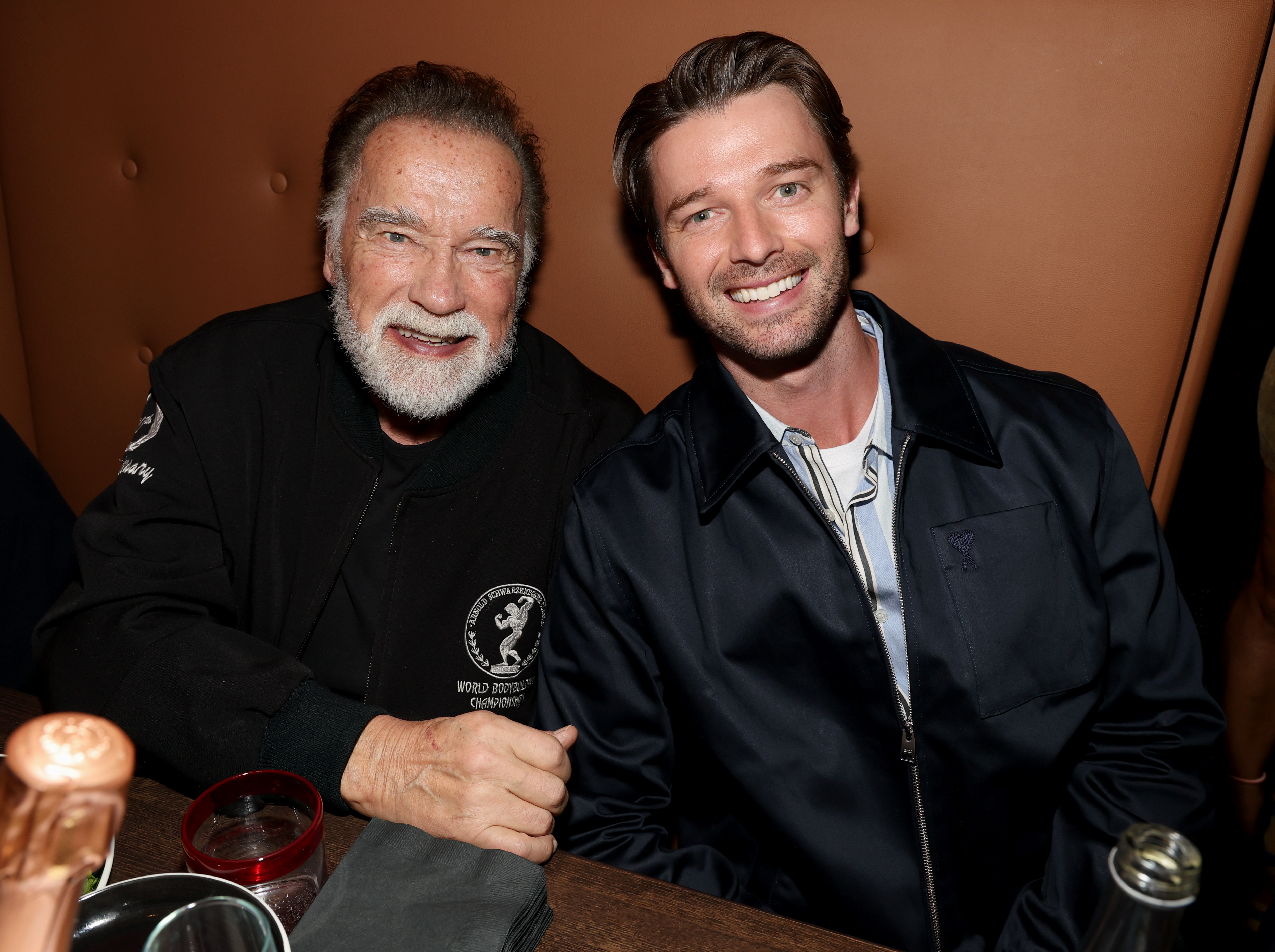 Arnold and Patrick Schwarzenegger smile. 