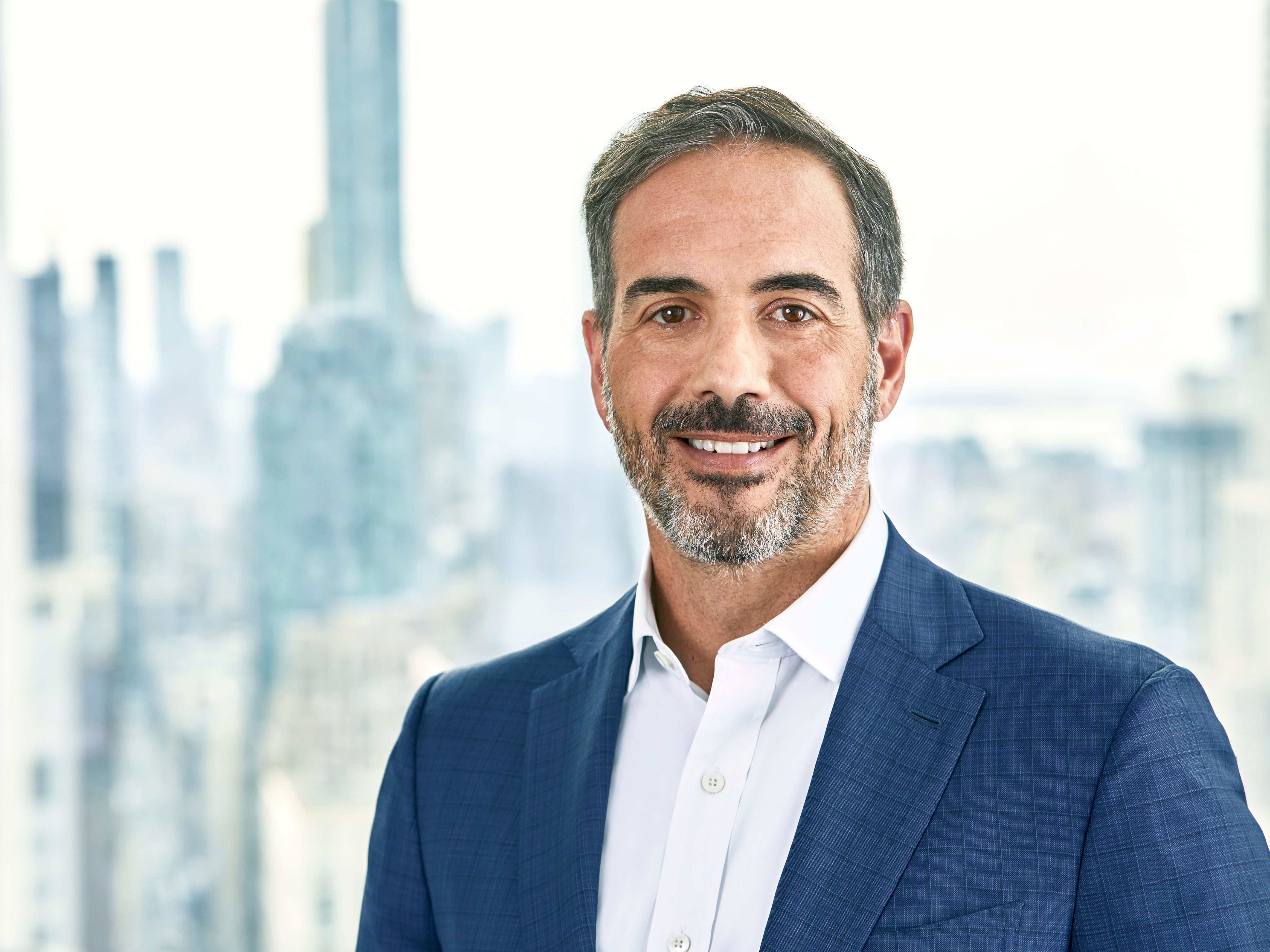 Chris Perriello, Global Head of Secondaries at Carlyle AlpInvest in a suit