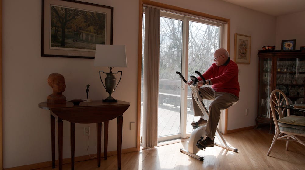 Jack Weber rides his stationary bike.