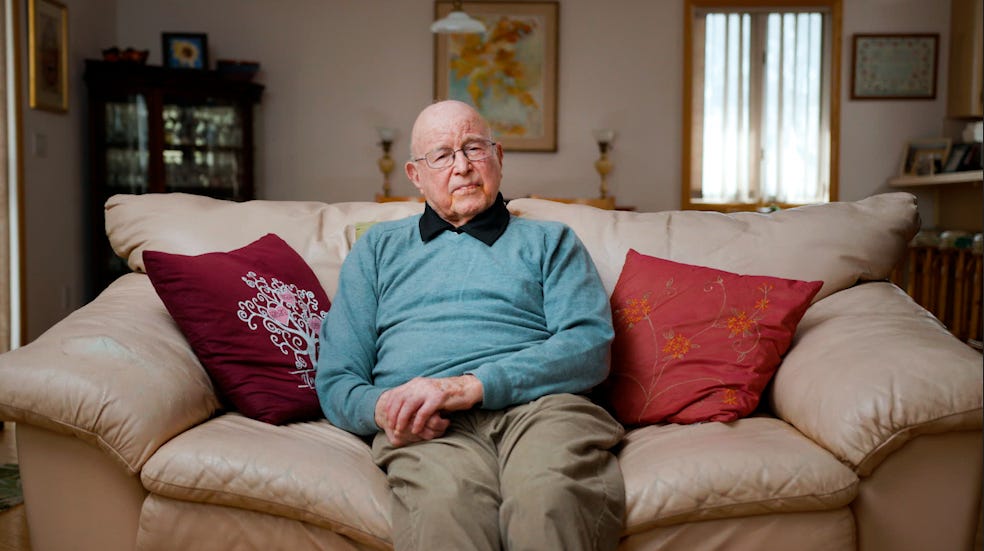 Jack Weber sitting on his couch.