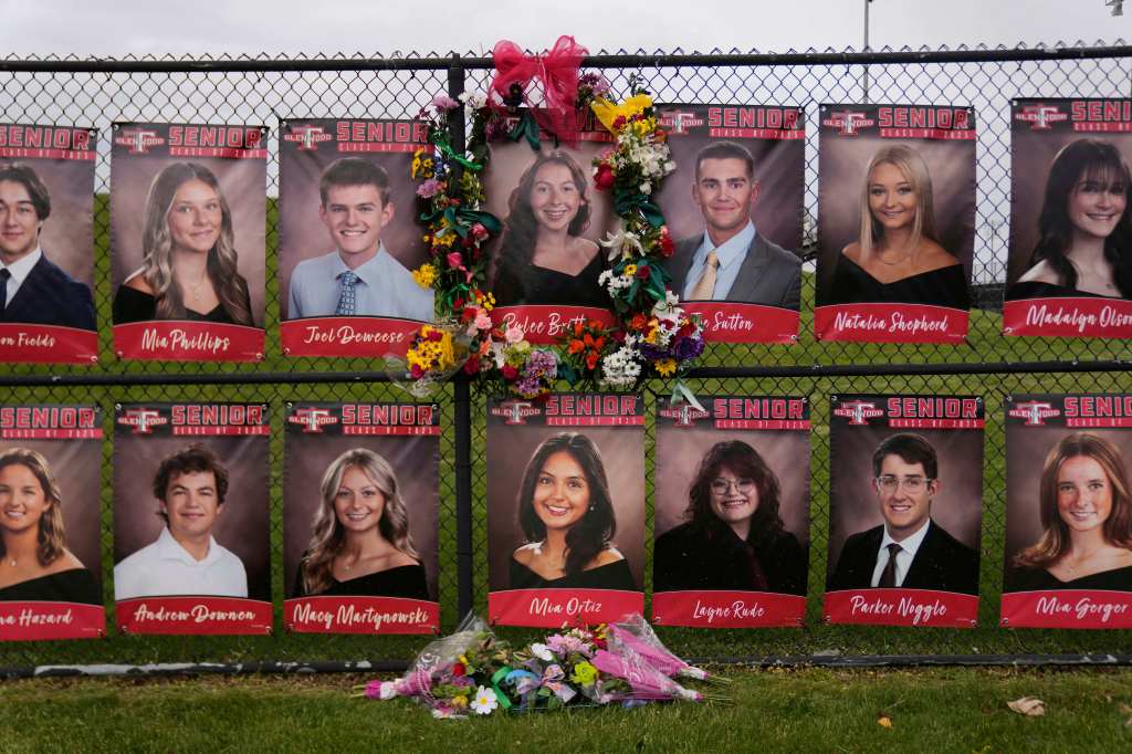 Memorial of flowers and photos of Glenwood High School Class of 2025 seniors.