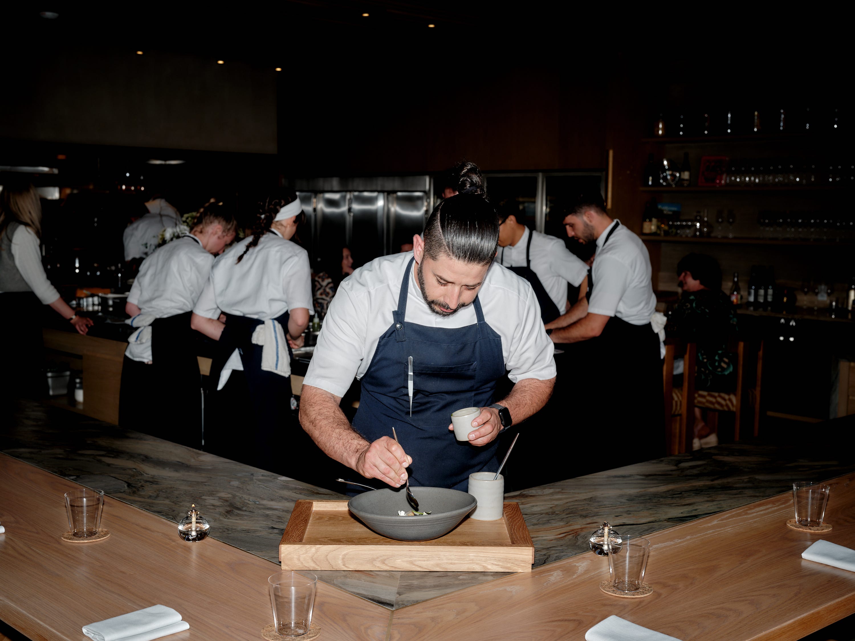 A chef prepares food at restaurant Lilo.