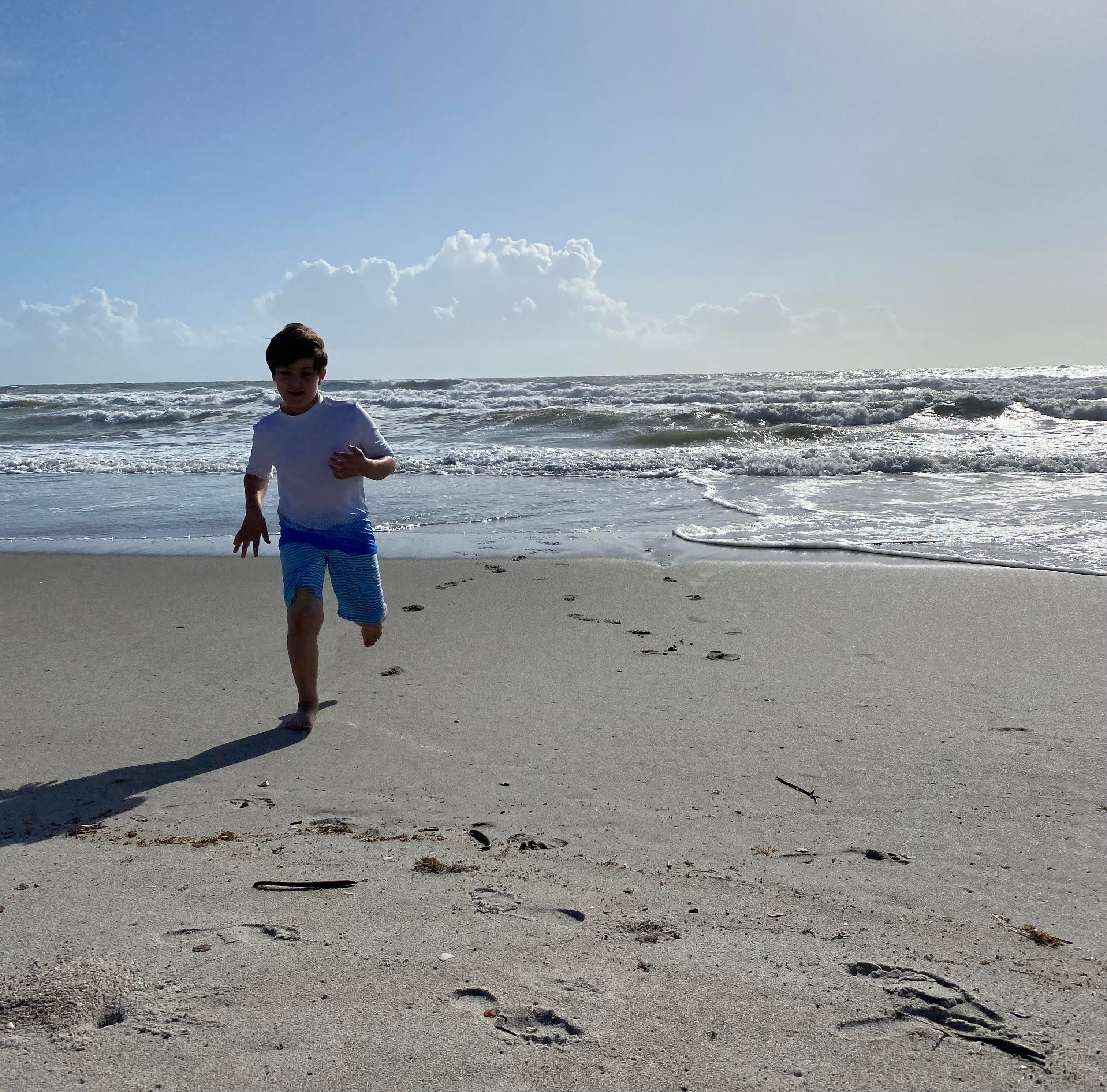Boy running on beach