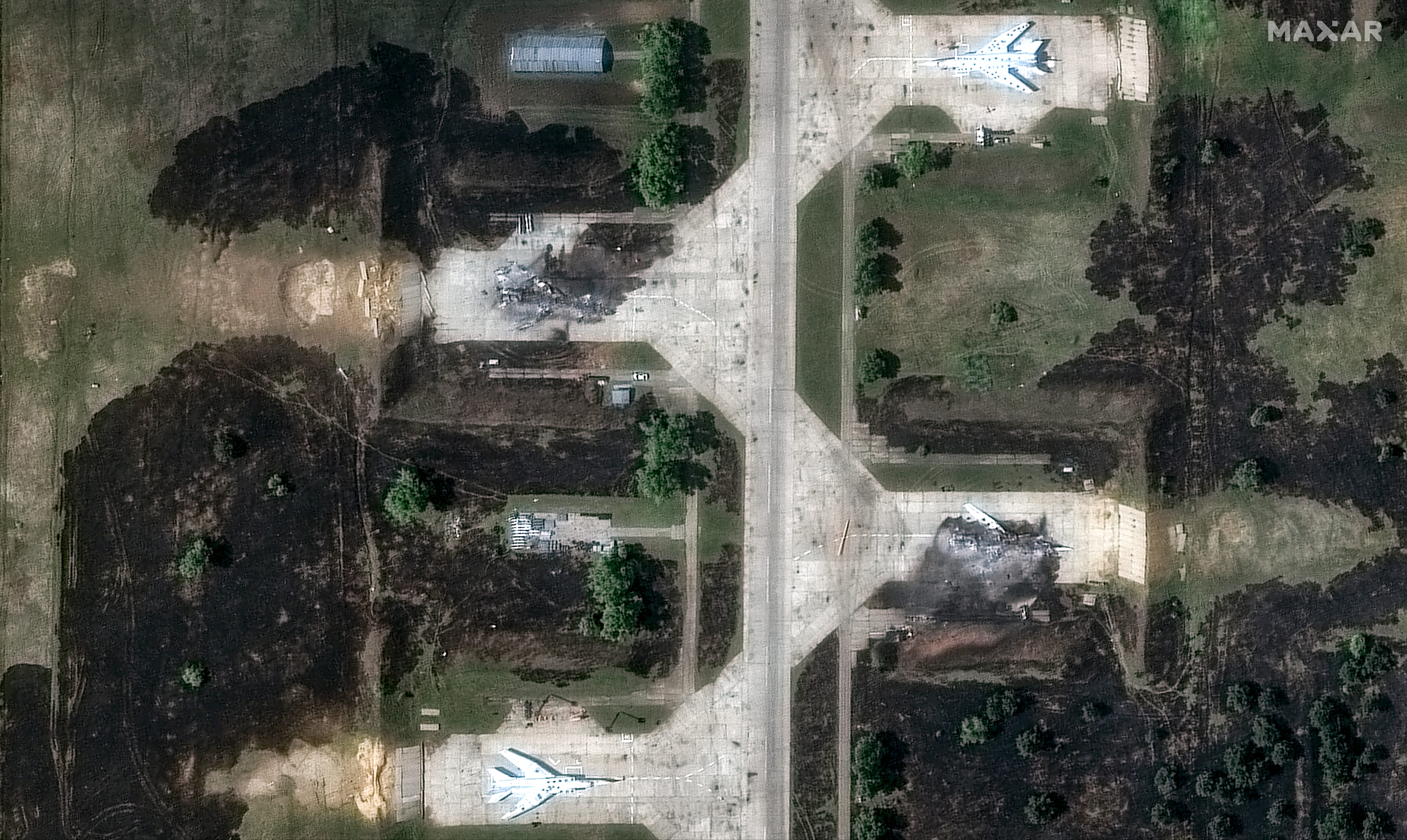 Two destroyed Tu-22 aircraft are seen at Belaya airbase on June 4.