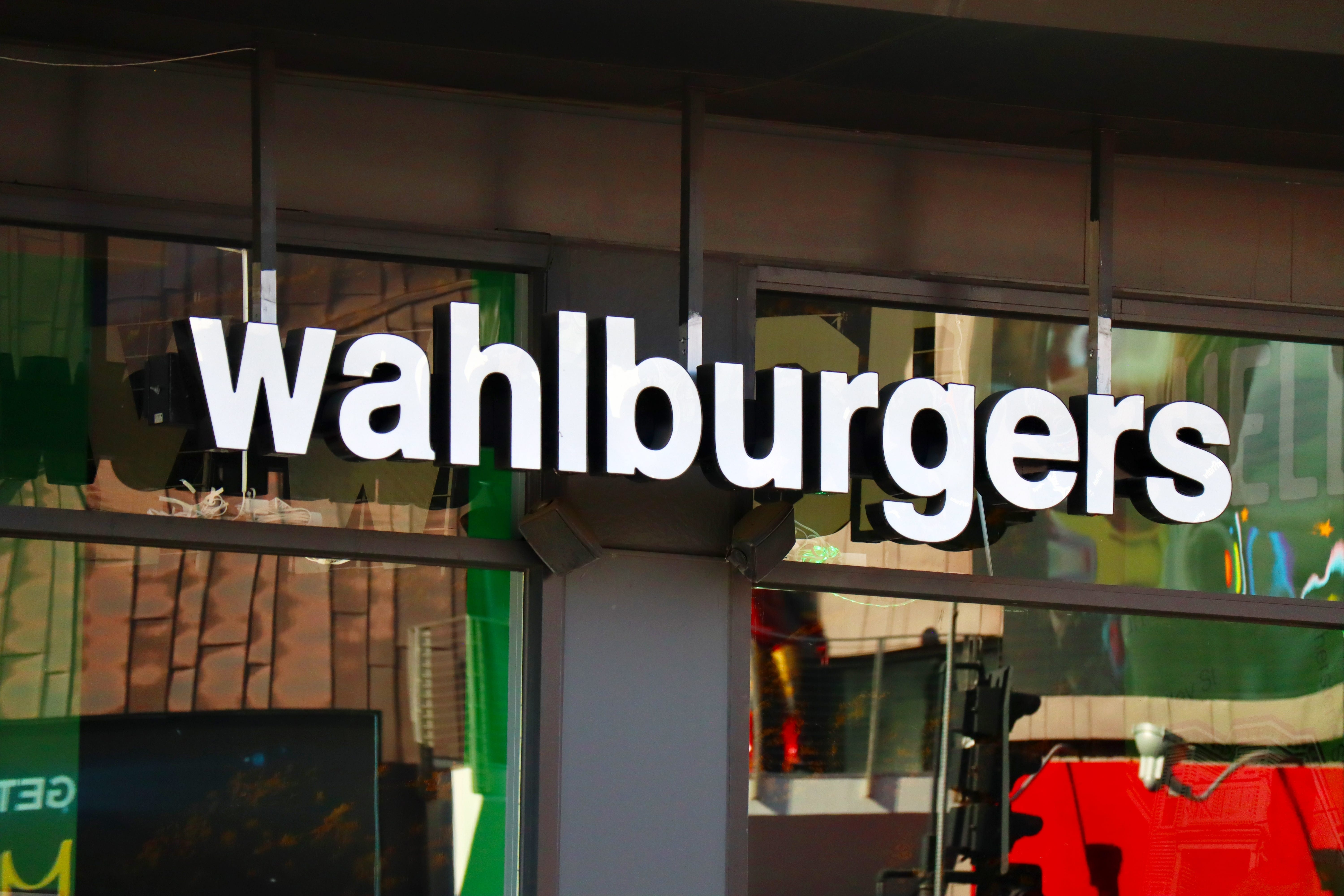 A Wahlburgers restaurant, with its logo prominently displayed.